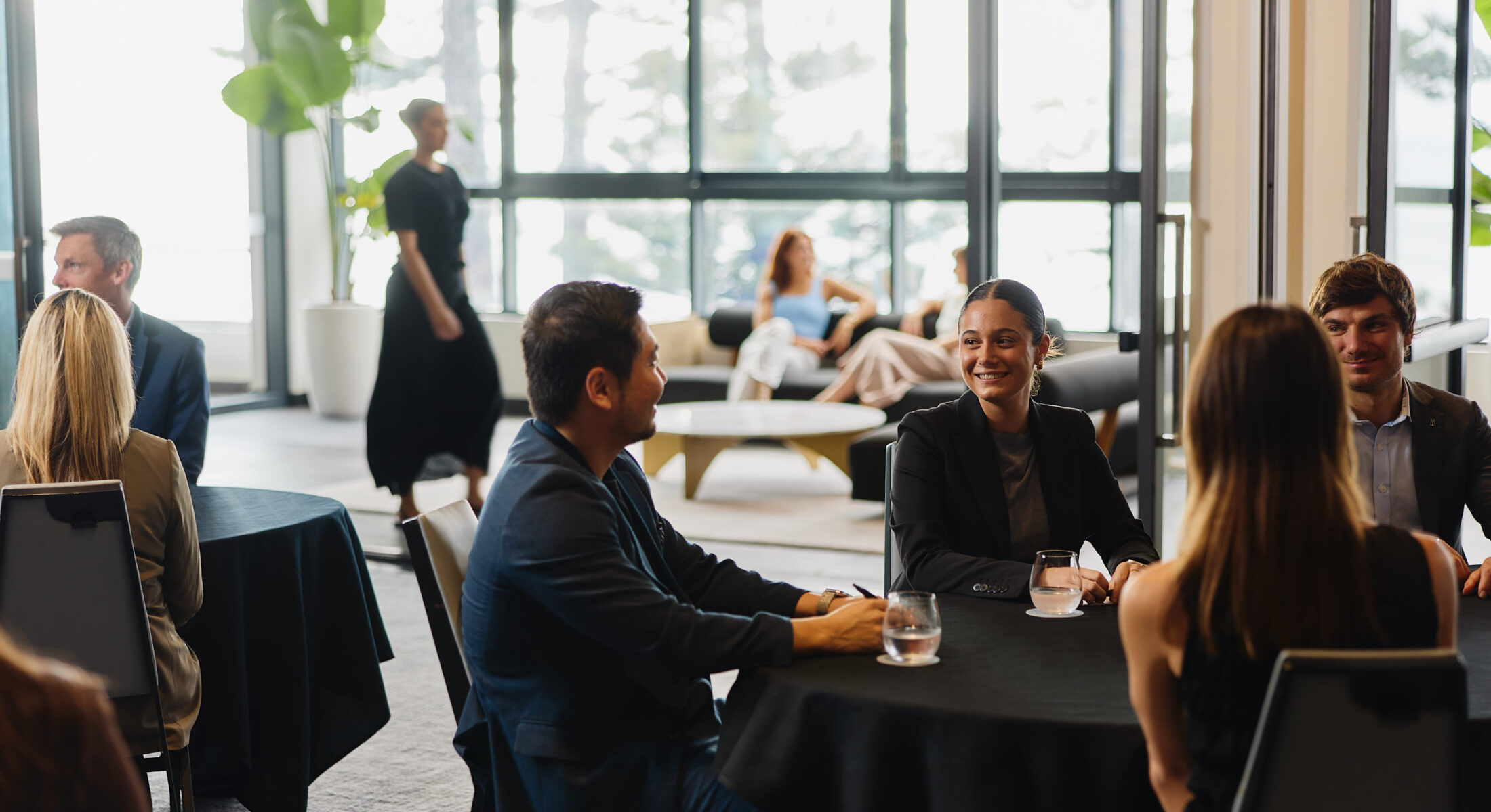 People conversing in modern conference venue Manly