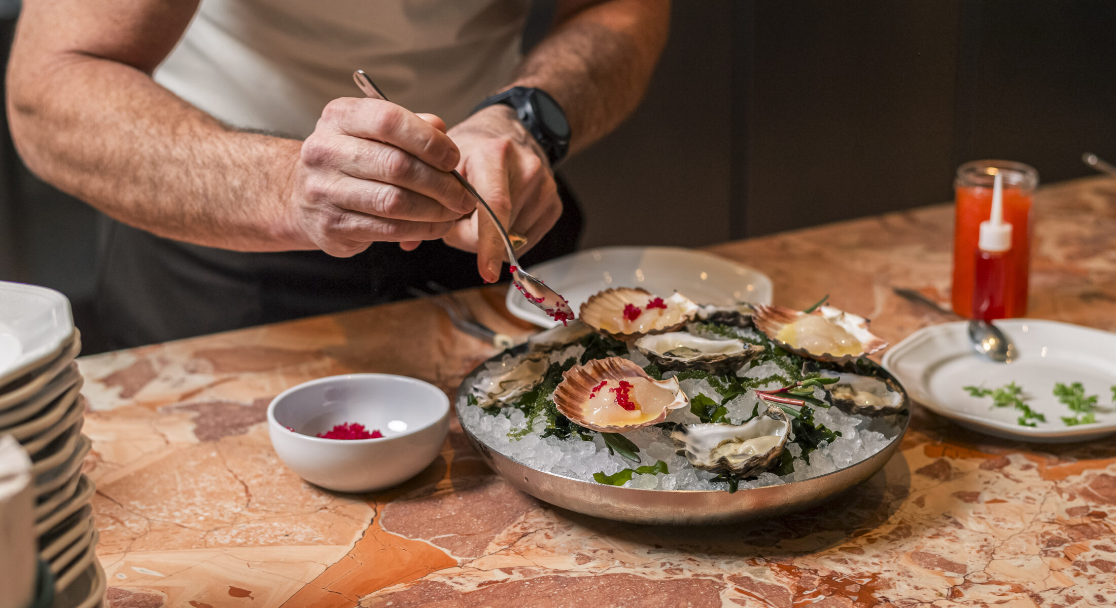 A chef serving food, catering Noosa